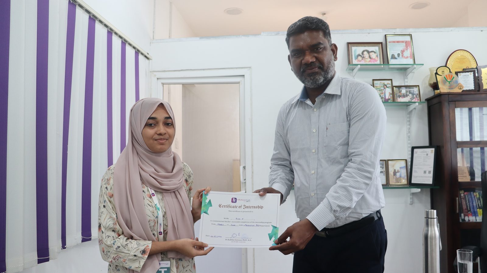Food Research Lab intern receiving a Certificate of Internship for the Production and R&D department