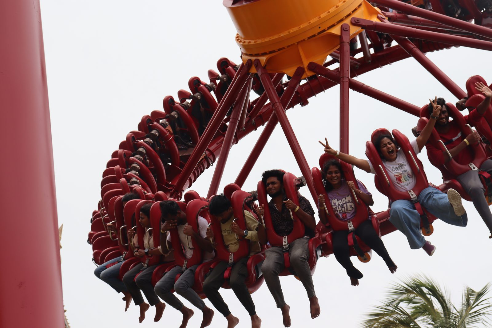 Guires colleagues cheering on a giant swing ride at VGP theme park during the Guires Day 2026 outing