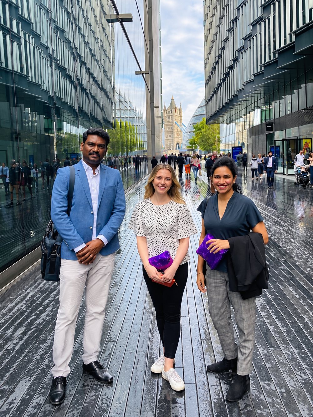 Guires team members in London, UK, with Tower Bridge in the background